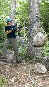 Emma sets a rock near the trail